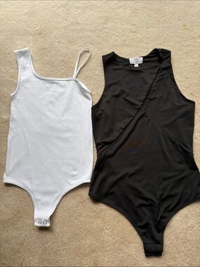 TWO body suits white and black